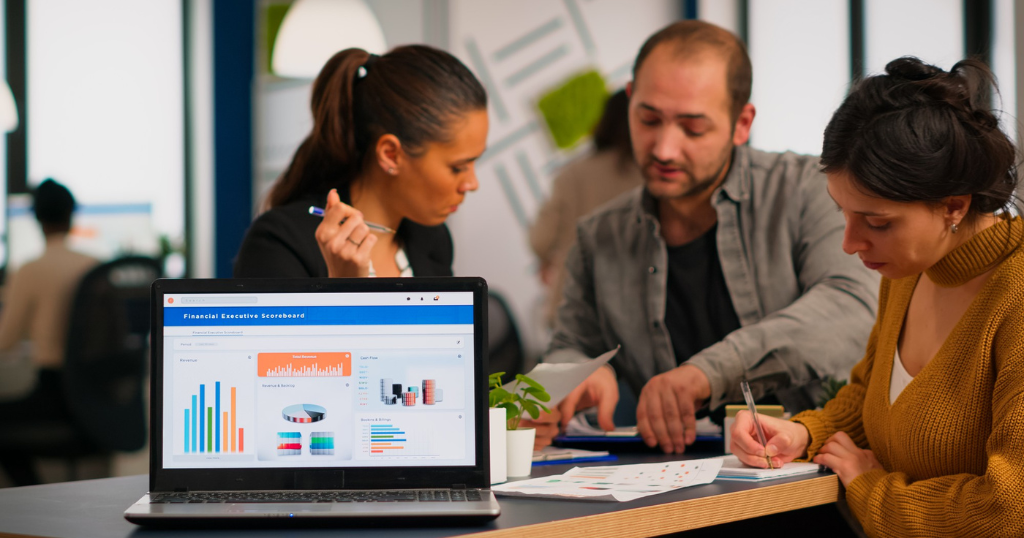 Professionals reviewing Google Ads Service data on financial scoreboards to optimize performance and improve business advertising strategies.