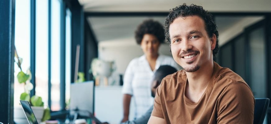 Smiling professional working with a Content Writing Agency.